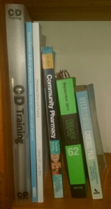 Pharmacy resources on a bookshelf